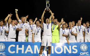 The All Whites celebrate with the ONC trophy.