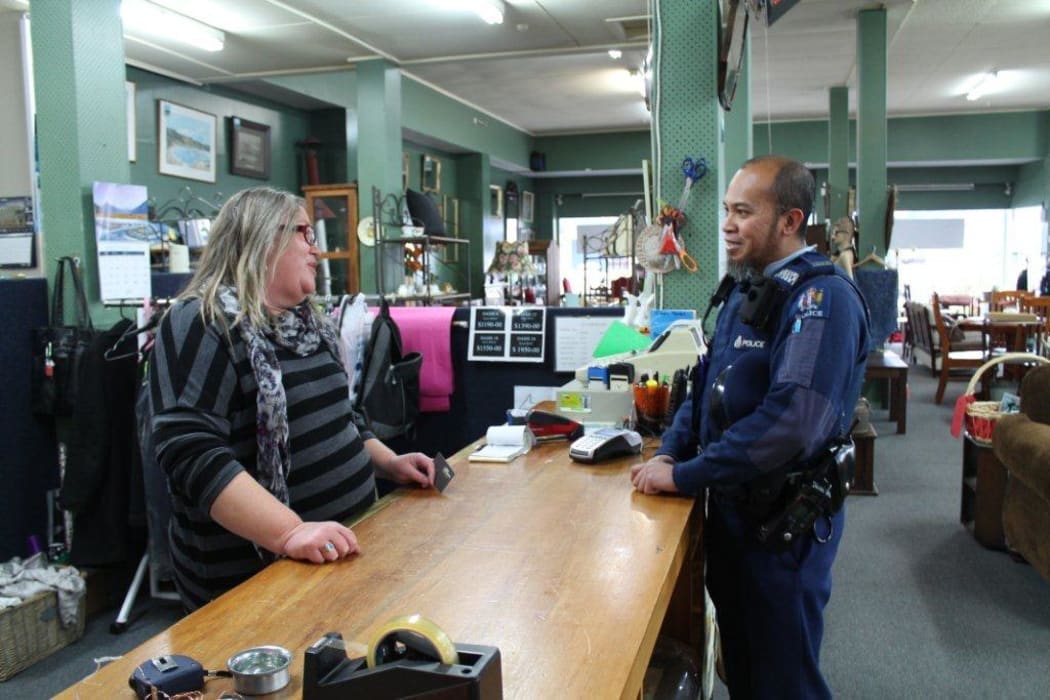 Marion Bennett (Bennetts Furniture), Taihape local chats to Constable Abu.