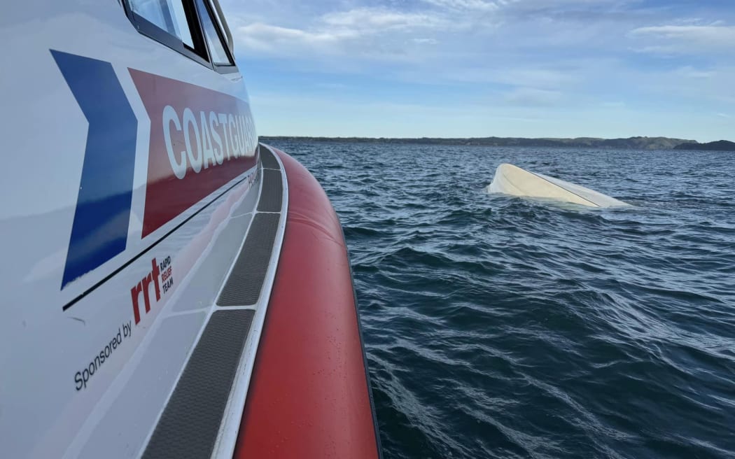 Five people were rescued after their boat capsized in Manukau Harbour.