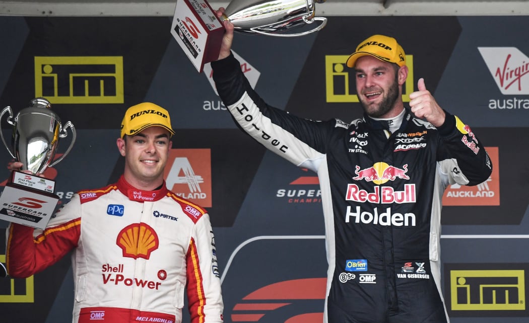Shane van Gisbergen celebrates winning race one of the 2018 Supercars round at Pukekohe ahead of fellow Kiwi driver Scott McLaughlin.