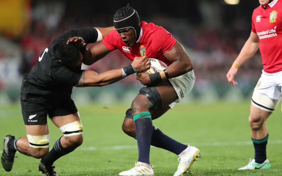 All Black Jerome Kaino is fended by Lions lock Maro Itoje.