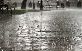 14731855 - dark grey city streets during heavy rain