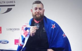 New Zealand weightlifter Stanislav Chalaev winning silver at the Commonwealth Games.
