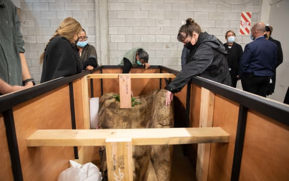 Hull of a centuries-old waka, unearthed in the banks of Te Awaikairangi, the Hutt River, is returned to its ancestral owners.