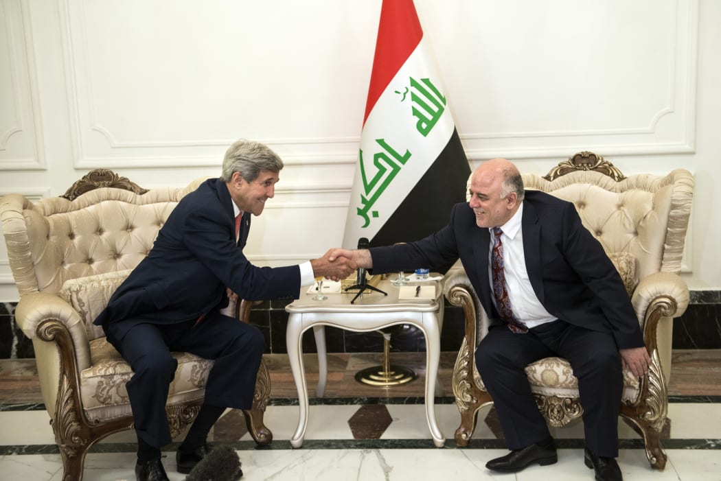 John Kerry (left) and new Iraqi Prime Minister Haider al-Abadi meeting in Baghdad.