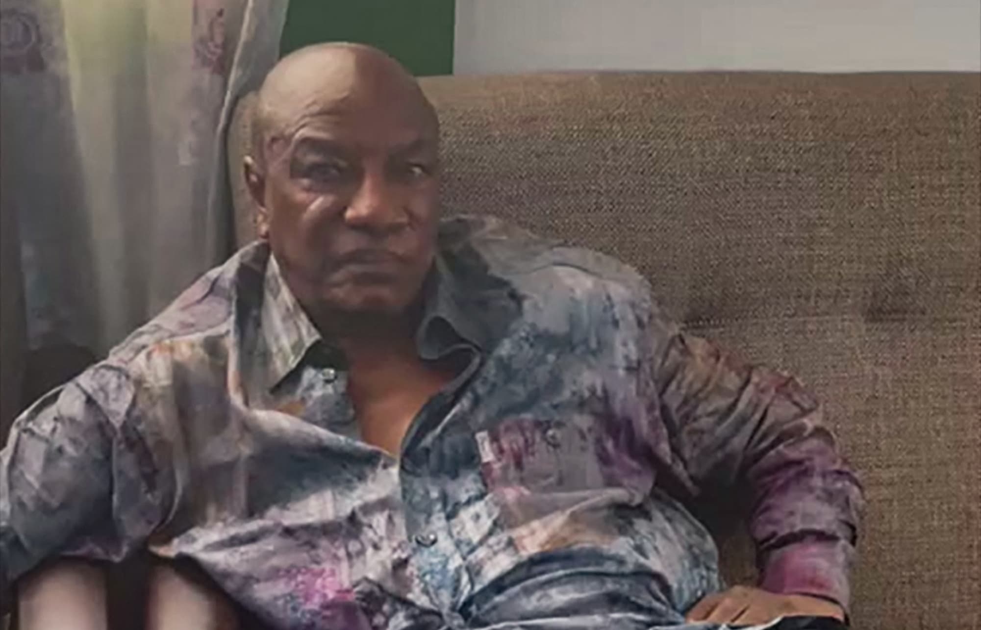 A screengrab taken from footage sent to AFP by a military source on 5 September 2021 shows the President of Guinea Alpha Conde after he was captured by army putschists during a coup d'etat in Conakry on 5 September 2021.