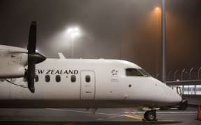 A regional Air New Zealand plane grounded at Auckland Airport due to fog. 6 July 2016.