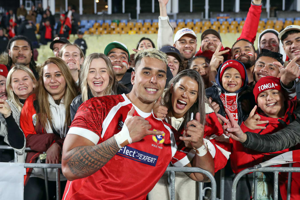 Harrison Mataele celebrates his debut for Tonga with friends and family post match.