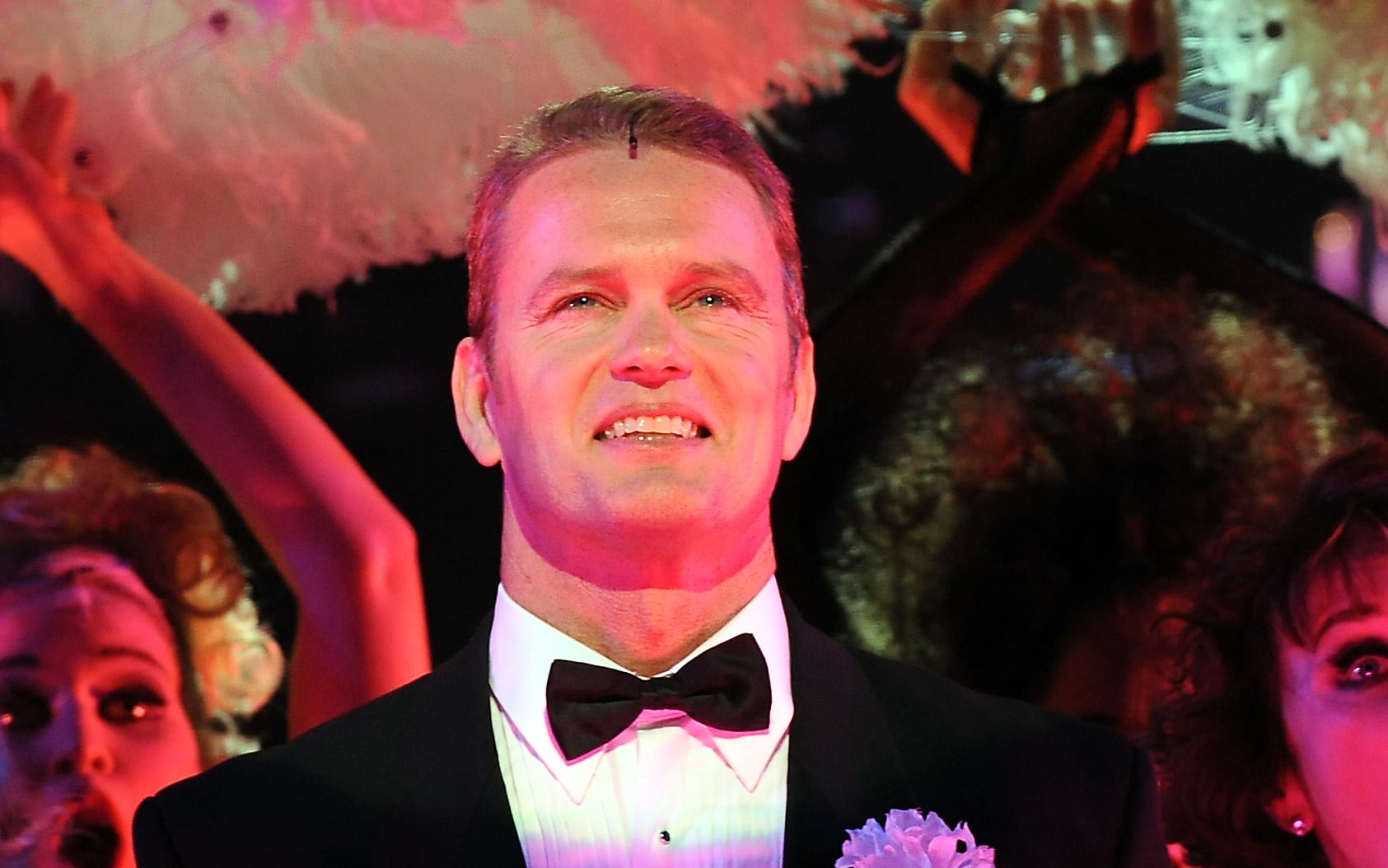 Craig McLachlan (C) plays the part of Billy Flynn during the final rehearsal of the hit musical 'Chicago' in Sydney on May 14, 2009. Known for its acclaimed score and sensational choreography, 'Chicago' is a story of murder, greed, corruption, exploitation, adultery and treachery.