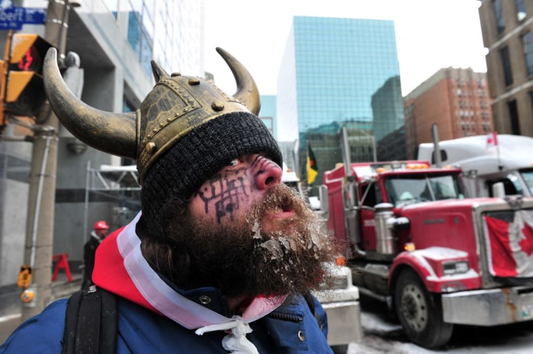 Supporters and truckers front the Parliament Hill during a protest in downtown of Ottawa, Canada, on February 12, 2022.