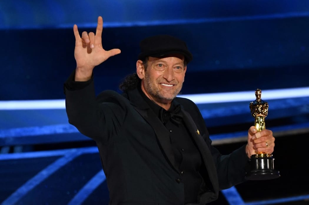 US actor Troy Kotsur accepts the award for Best Actor in a Supporting Role for "CODA" onstage during the 94th Oscars at the Dolby Theatre in Hollywood, California on March 27, 2022.
