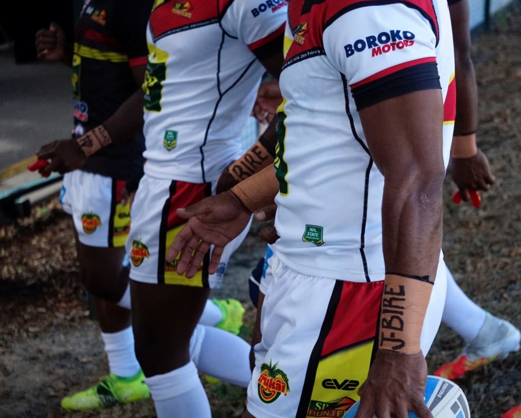PNG Hunters players show their support for Jokadi Bire during the Round 11 match against Burleigh Bears.