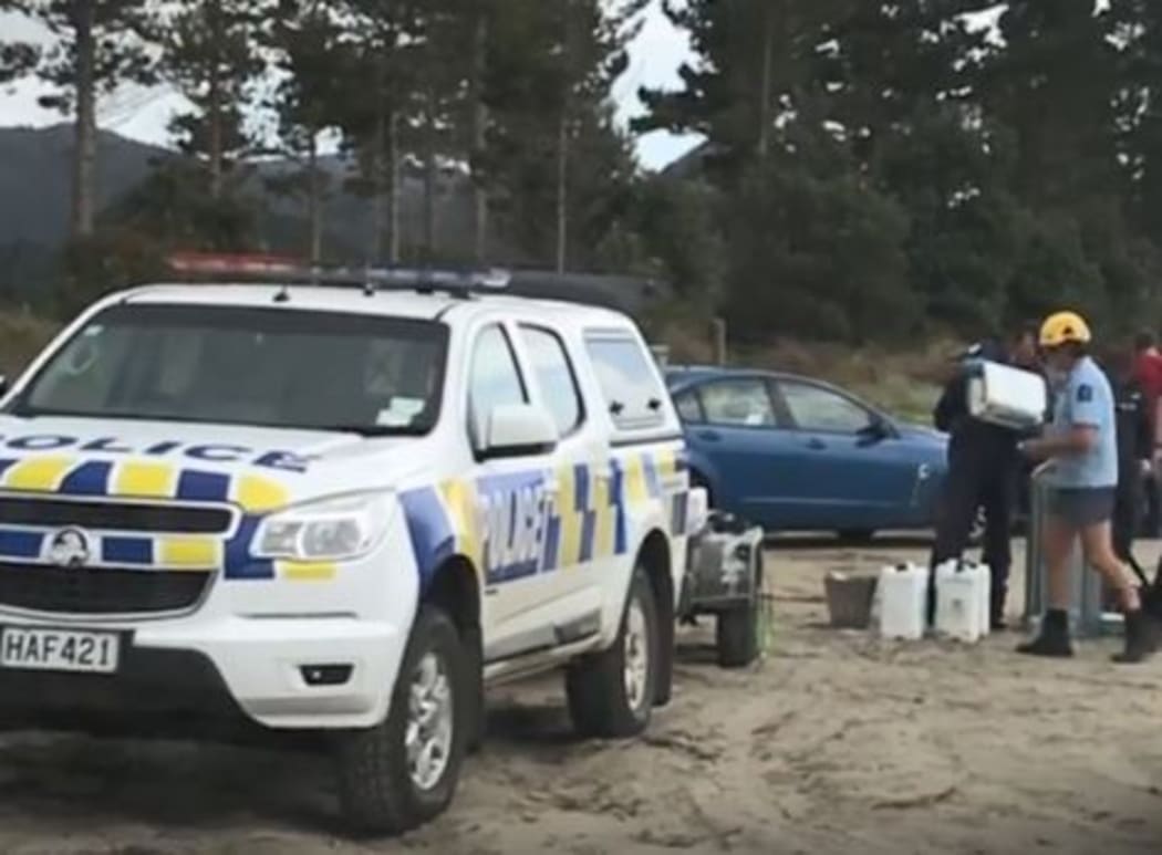 Police at the scene of the spill.