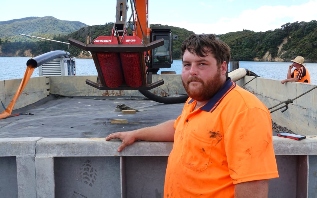 Andrew Johnson, of Russell firm Johnson Brothers, with the caulerpa suction dredge he designed and built.