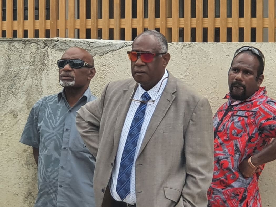 Ishmael Kalsakau, centre, outside the courthouse
