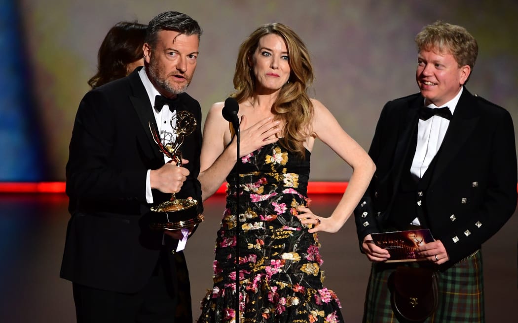 Annabel Jones (C), Charlie Brooker (L) and Russell McLean (R) accept the award for Outstanding Television Movie "Bandersnatch"