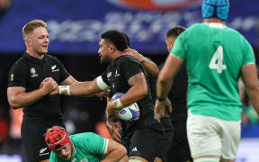 All Blacks Sam Cane, left and Ardie Savea celebrate winning a penalty in the 2023 Rugby World Cup quarter-final match between New Zealand and Ireland.