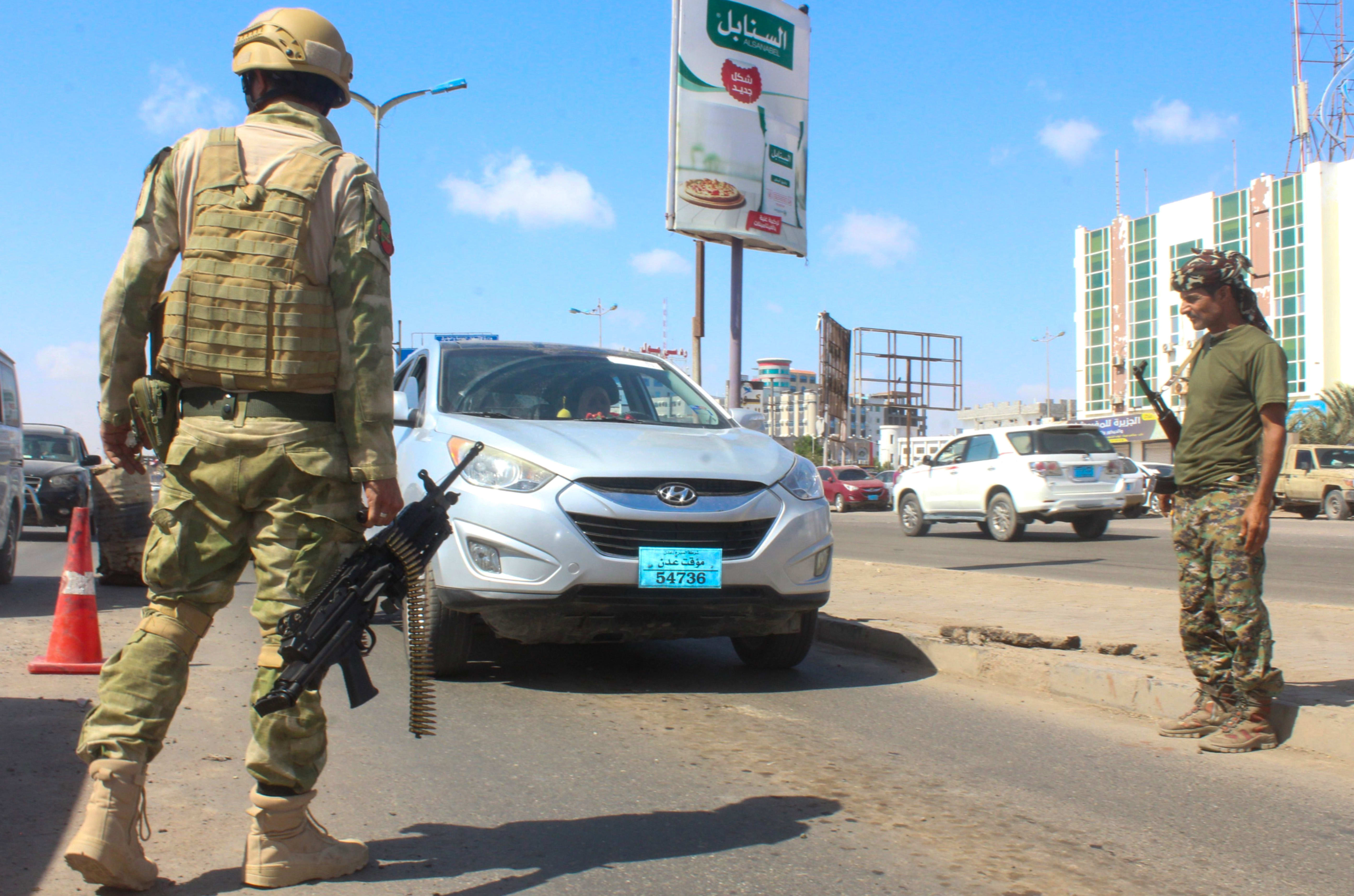Fighters with the Saudi-backed coalition man a checkpoint in Dar Sad, north of Yemen's southern city of Aden on December 31, 2020.