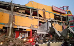 A collapsed shopping mall in Palu, Central Sulawesi after a 7.5 magnitude earthquake hit the area.