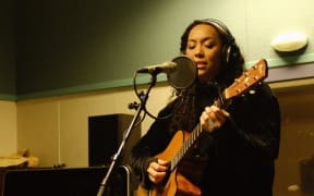 Wellington musician AJA performing in RNZ's Wellington studio