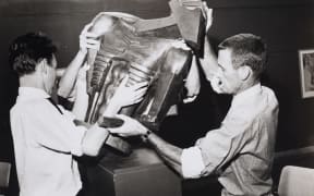 Colin McCahon installing Jacob Epstein’s Rock Drill 1961
black and white photographic print