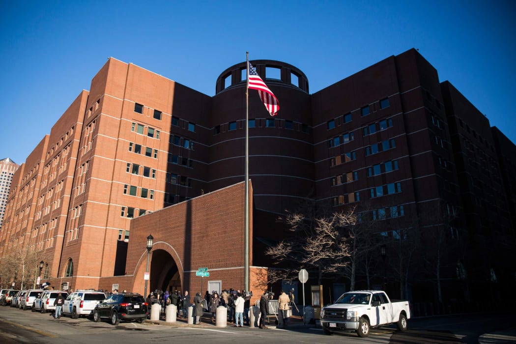 Media gather outside the John Joseph Moakley United States Courthouse, where jury selection has begun in the case against Dzhokhar Tsarnaev.