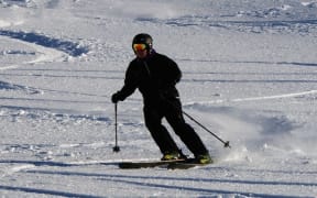 Skiers get in their first turns for the 2014 snow season at Mt Hutt.