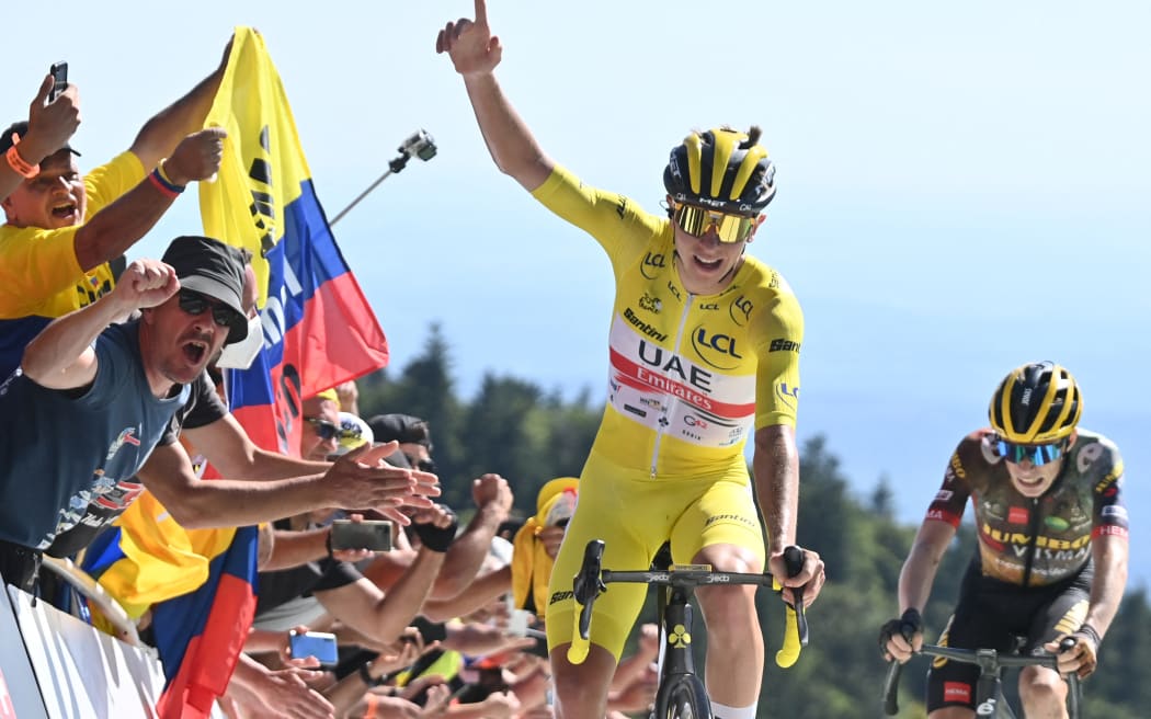 Slovenian Tadej Pogacar of UAE Team Emirates celebrates as he beats Slovenian Primoz Roglic of Jumbo-Visma in the last meters of the climb to the finish of stage seven of the Tour de France cycling race, a 176 km race from Tomblaine to La Super Planche des Belles Filles, France, on Friday 08 July 2022. This year's Tour de France takes place from 01 to 24 July 2022.
BELGA PHOTO POOL DAVID STOCKMAN - UK OUT (Photo by DAVID STOCKMAN / BELGA MAG / Belga via AFP)