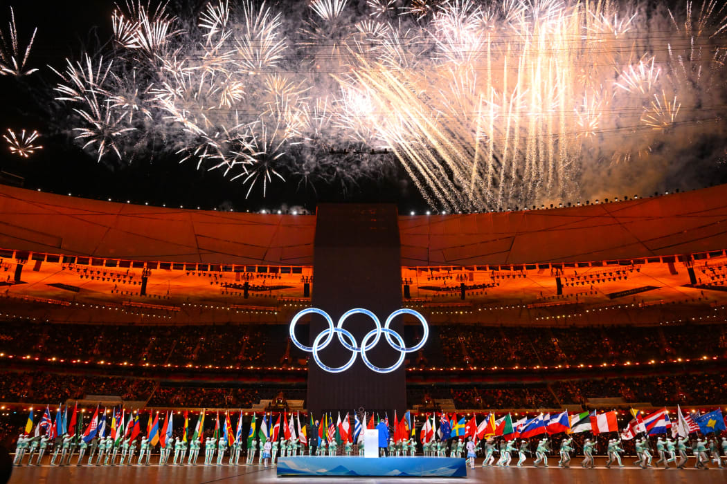 Fireworks explode over the Olympic rings during the opening ceremony of the Beijing 2022 Winter Olympic Games, at the National Stadium, known as the Bird's Nest, in Beijing, on February 4, 2022.
