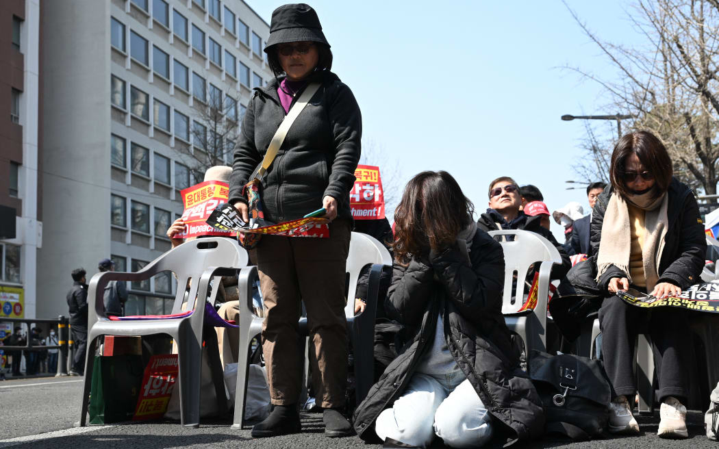 Supporters of South Korea president Yoon Suk Yeol react after the Constitutional Court's verdict on Yoon's impeachment outside the court in Seoul on 4 April, 2025.