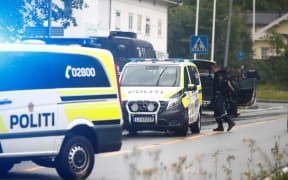 Police vehicles near Norway's al-Noor Islamic Center mosque where a gunman opened fire.