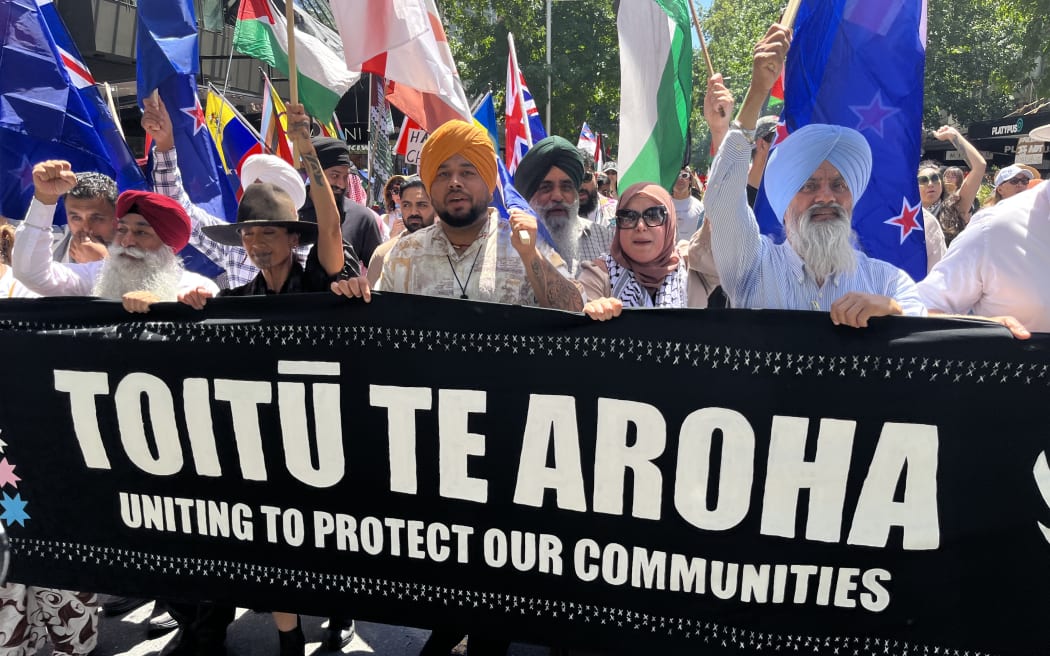 Hundreds marched in a peace rally organised by Toitu te Aroha in Auckland's CBD