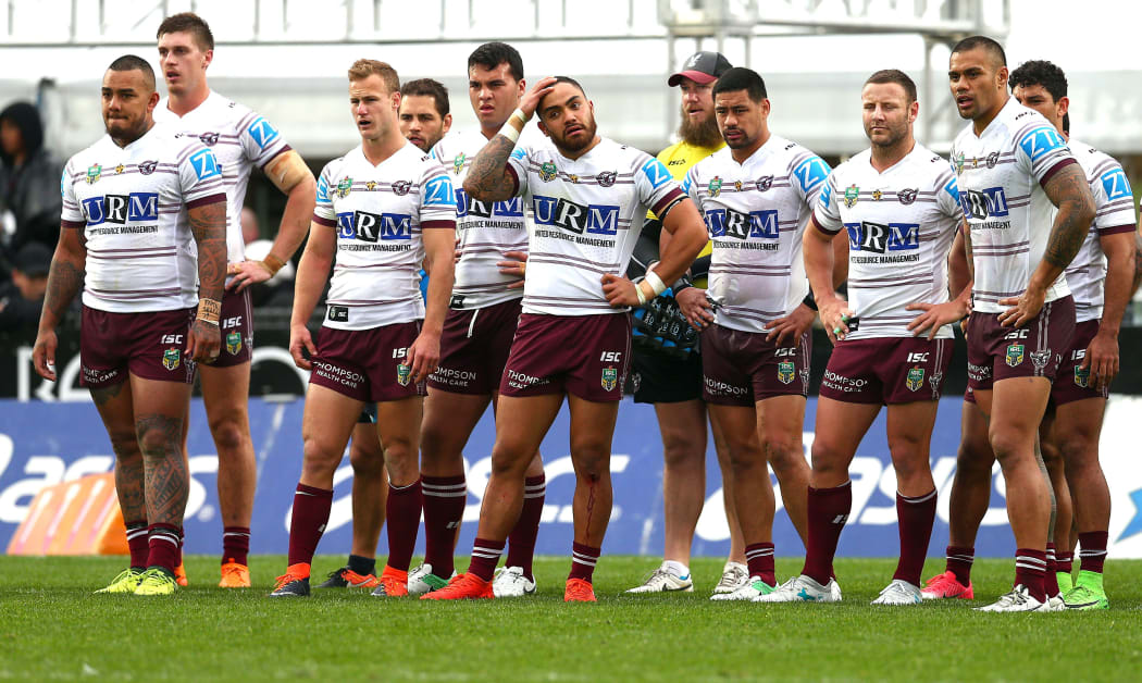 Manly players look on during a match against the Warriors.