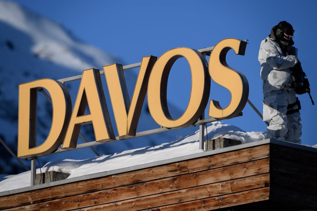 In this file photo taken on January 20, 2020, a policeman  stands on the rooftop of a hotel during the World Economic Forum (WEF) annual meeting in Davos.