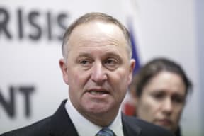 Media conference in the bunker at Parliament. John Key speaks to media.
