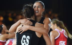 Maria Tutaia hugs Jodi Brown after a dramatic 1 point win over England in the Netball Semi Final match. Glasgow Commonwealth Games