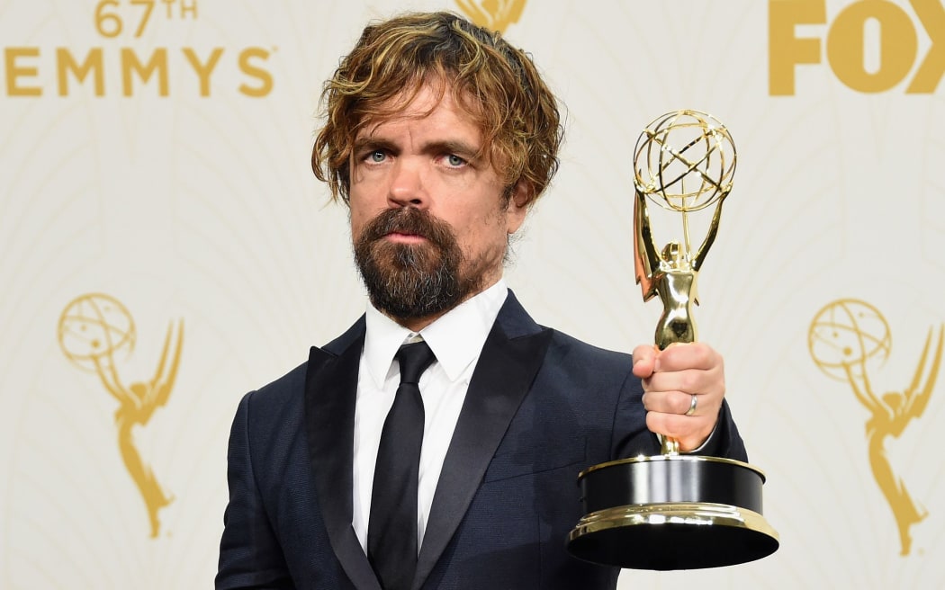 Actor Peter Dinklage show shis Outstanding Supporting Actor Emmy for Game of Thrones Jason Merritt/Getty Images/AFP