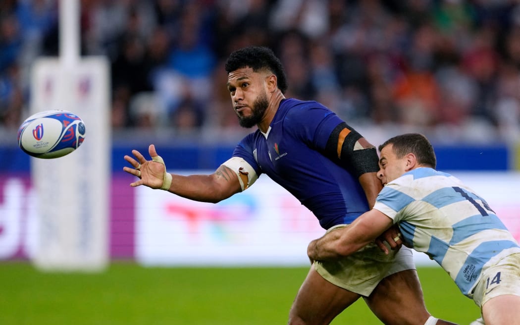 Samoa's inside centre Tumua Manu (centre) is tackled by Argentina's wing Emiliano Boffelli during the Rugby World Cup Pool D match at Stade Geoffroy-Guichard in Saint-Etienne, south-eastern France on 22 September, 2023.