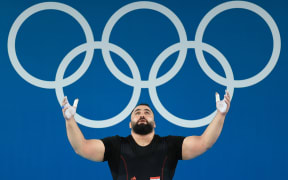 Man Asaad of Syria competes in the 102kg category of the Men's Weightlifting at the 2024 Paris Olympics.