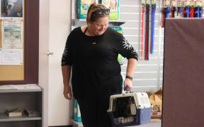 Zoe Miles collecting her two one-year-old cats.