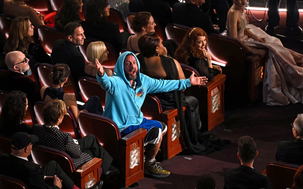 US comedian, actor Adam Sandler speaks during the 97th Annual Academy Awards at the Dolby Theatre in Hollywood, California on March 2, 2025. (Photo by Patrick T. Fallon / AFP)