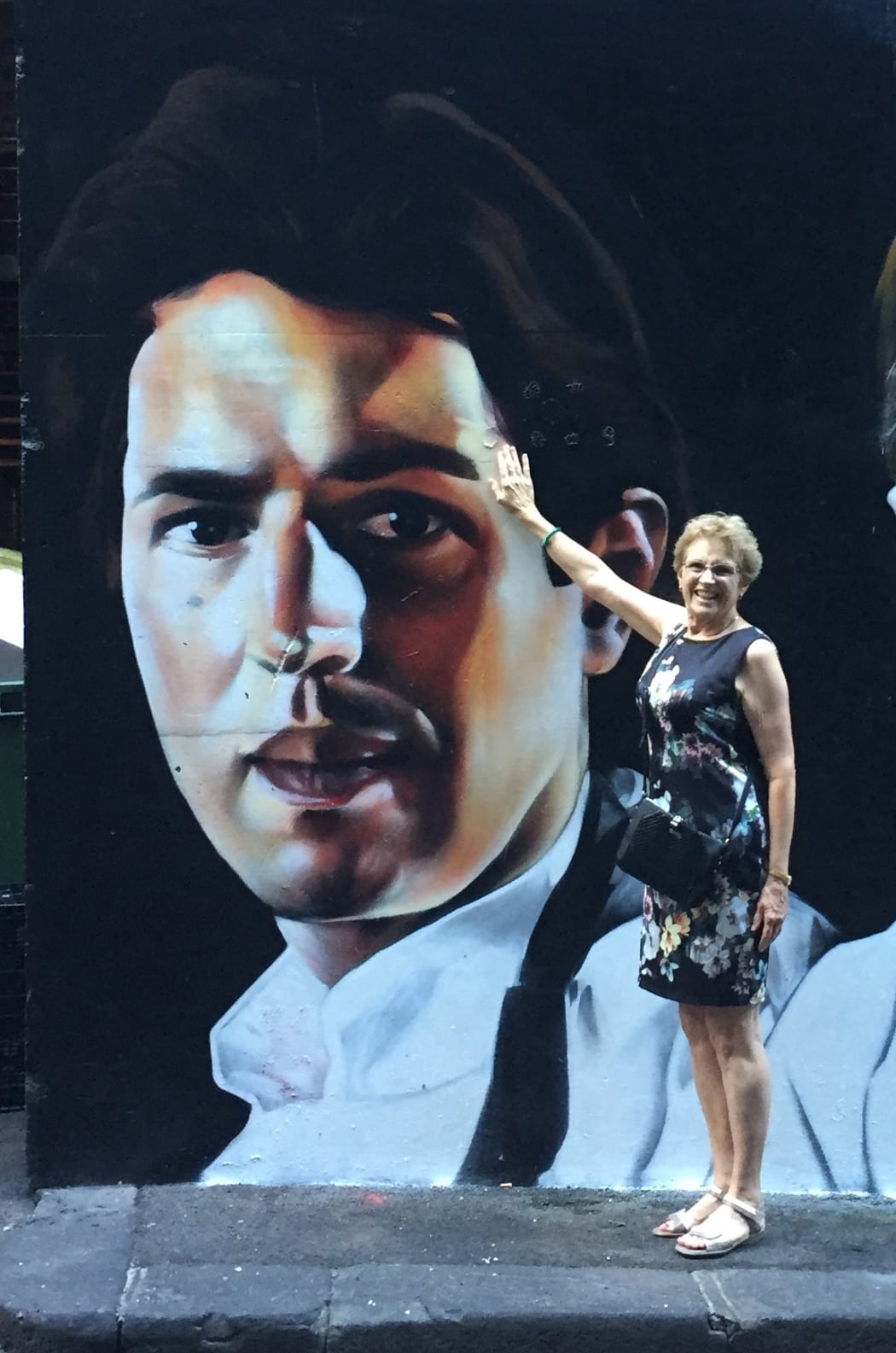 Kaye Shewry in front of mural of her son Ben Shewry in Melbourne