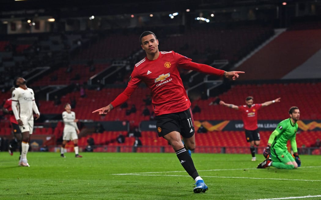 Manchester United striker Mason Greenwood celebrates after scoring their sixth goal during the UEFA Europa League semi-final, first leg against Roma at Old Trafford stadium in Manchester, north west England, on April 29, 2021.