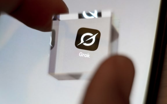 The Grok application appears on a smartphone screen in this photo illustration in Athens, Greece, on October 2, 2025. (Photo Illustration by Nikolas Kokovlis/NurPhoto) (Photo by Nikolas Kokovlis / NurPhoto via AFP)