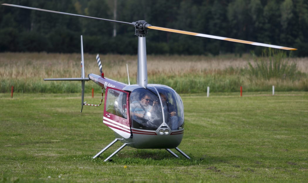 A file photos shows a Robinson R44 helicopter taking off in Latvia in 2011.