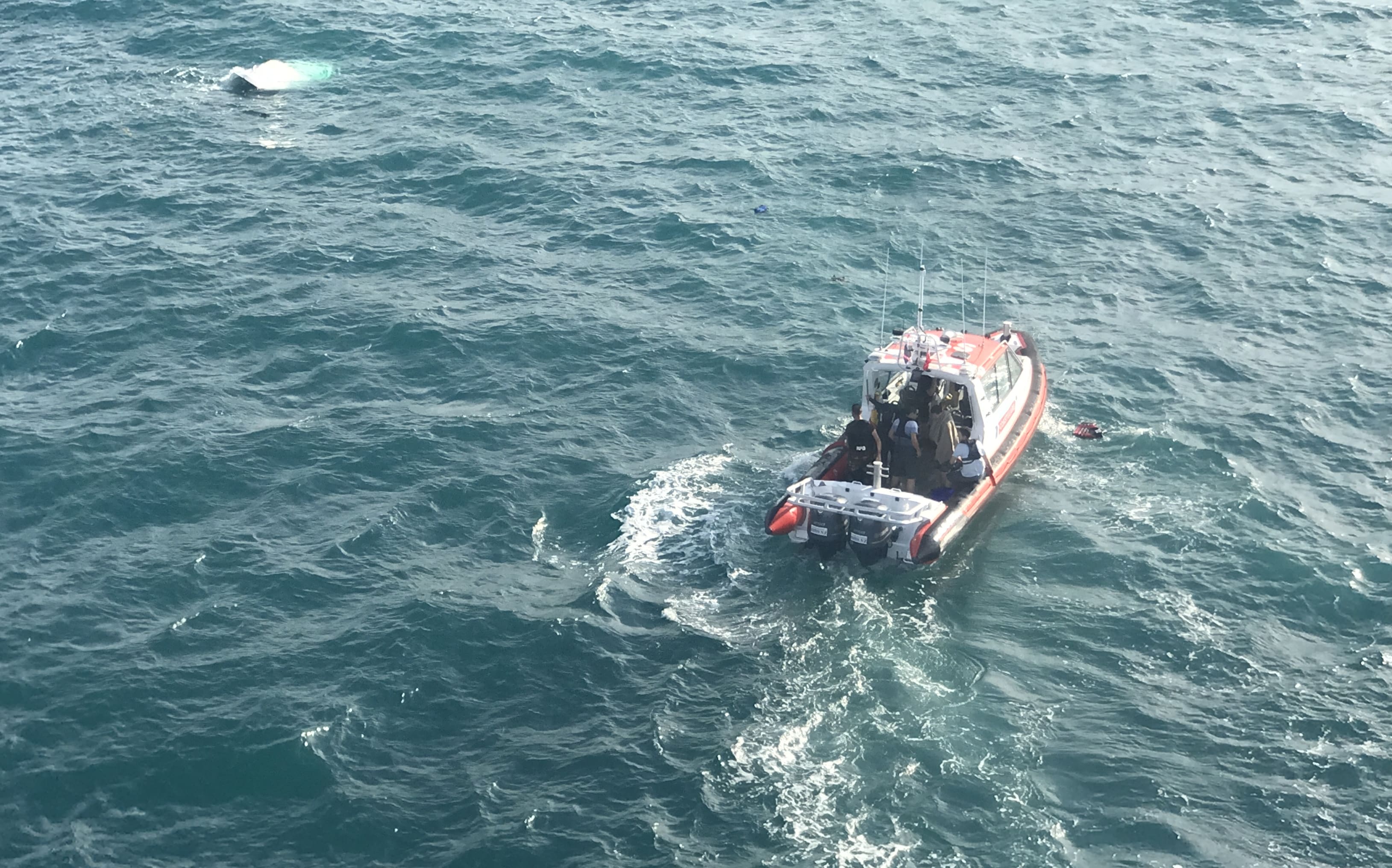 The men were rescued about 3km north of Big Manly, Whangaparaoa.