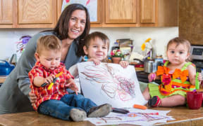 mother with three young children