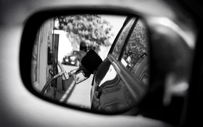 Composite of car mirror and fuel pump.