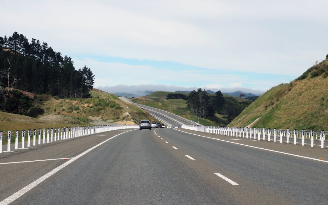 WELLINGTON, NEW ZEALAND - MARCH 30: Cars drive down the new Transmission Gully section of SH1 motorway during a media tour on March 30, 2022 in Wellington, New Zealand. The $1.25 billion, 27-kilometre Transmission Gully road out of Wellington will open to drivers this week. (Photo by Lynn Grieveson/Getty Images)