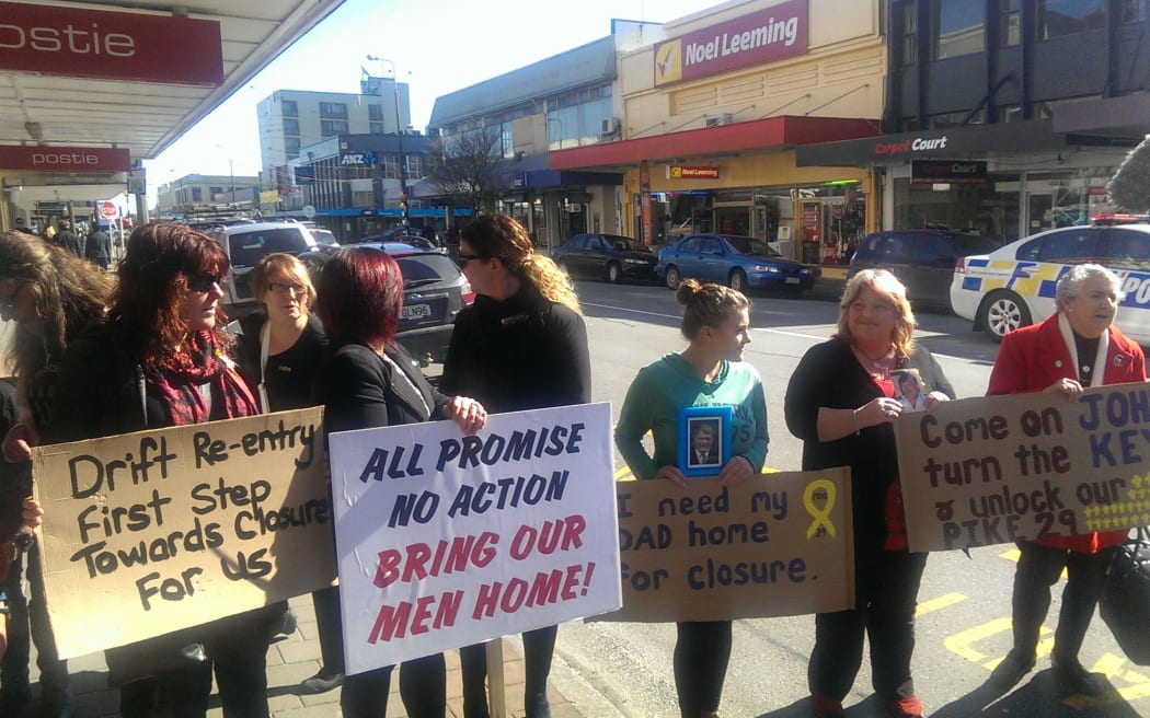 Relatives of Pike River victims protesting in Greymouth against Mr Key's visit.